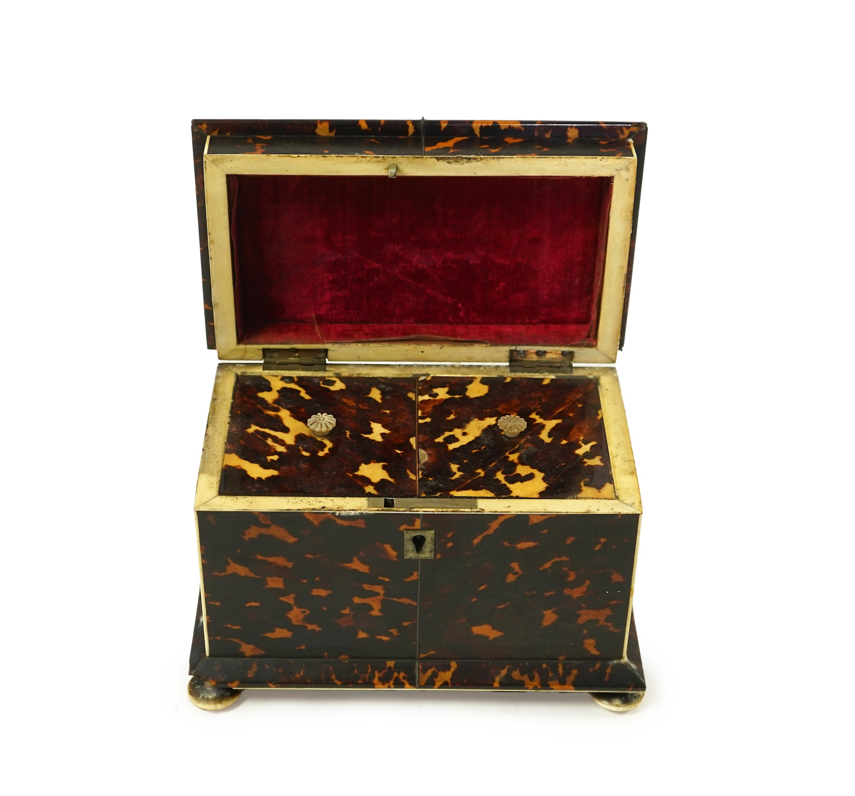 An early Victorian tortoiseshell tea caddy